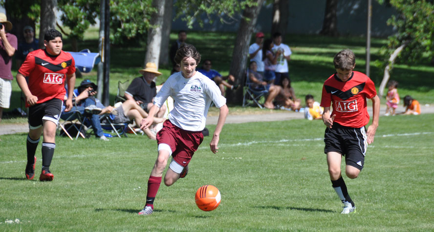 Alex running through for the Thunder, who won  the local league and District Cup this fall.. Alex was a key component of his team.