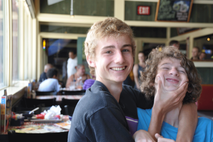Brotherly love! This was at Nick's birthday lunch at the local Chili's, which he chose in order to please his kid brothers. Charlie lent a hand when Alex did not feel like smiling for the camera.