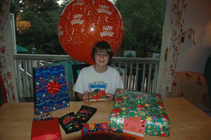 A birthday at home, Alex's 11th in early 2009, with presents and a LARGE birthday balloon!