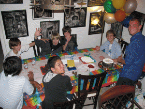 Another birthday at home, this one Charlie's 13th in 2008. He had a few friends over to share the cake, being delivered by Alban, our resident cake slicing specialist!