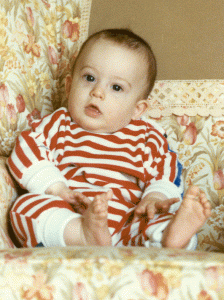 The required baby shot, taken on the sofa at his Grandma's house in Marlow (just west of London on the Thames) in March 1990. He was about six months old, and our little family was on one of its regular visits to grandma.