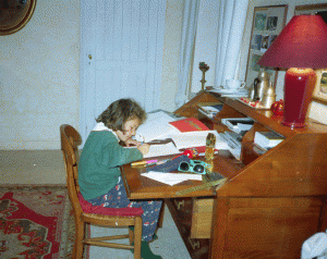 Daphné hard at work at Ian's desk in Le Tahu, our first home together, in November 1994 (age 7)