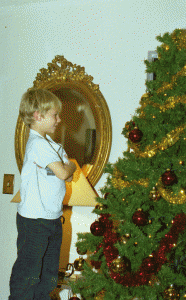 Charles admiring the 2009 tree while it was being decorated. We had yet to repaint the walls, but felt very good that the gilded mirror was back in its place.