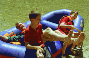 Check out the knees here! Rented raft photo no. 2. The boys upended their poor, long-suffering father just after the other photo was taken!