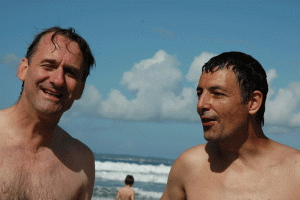 Karim and I on a Breton beach during the summer of 2004 after splashing around in the sea behind us.