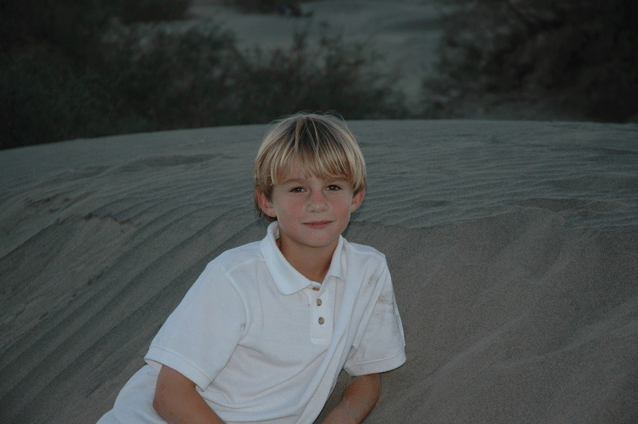 Charlie lounging on a dune in Death Valley, from Thanksgiving 2004.