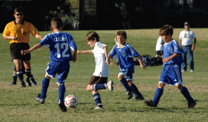 Alex's team was the Sharks, and here he is dribbling in traffic.