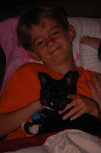 Charlie with Snip on his lap in the living room, 2005