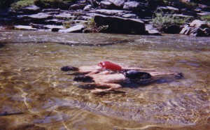 Nick and Tom float with their heads under water in the freezing pool we found at the top of Yosemite Falls.