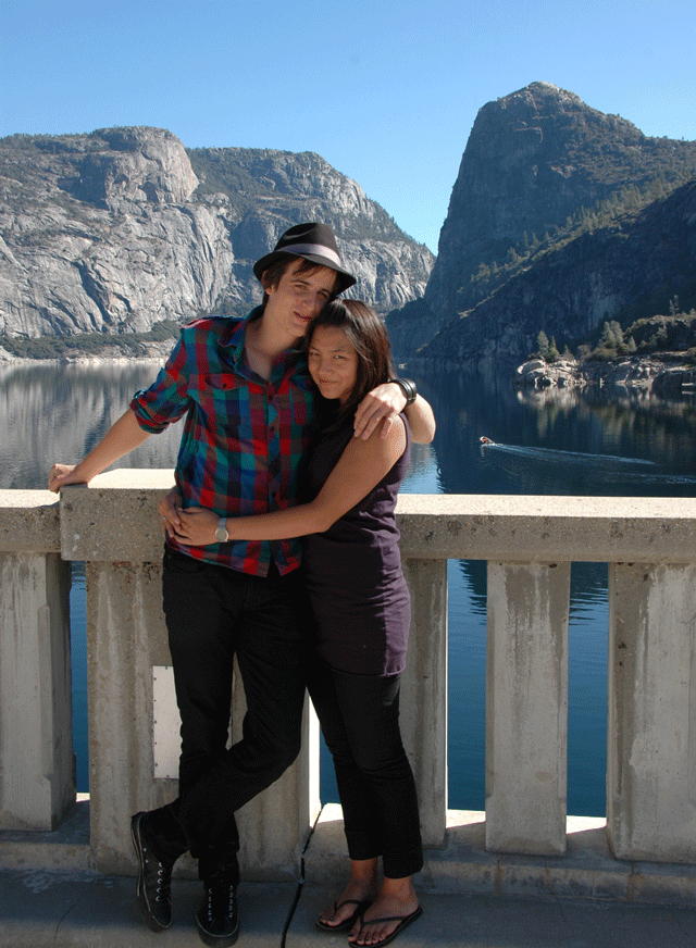 Tom and Maureen on the dam itself in front of Hetch Hetchy Dome, a close cousin of Half Dome above the Yosemite Valley floor. The boat behind was a park ranger: boating and bathing are forbidden in the lake because it will all become drinking water.