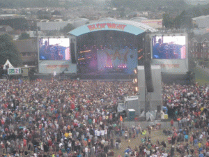 The stage in daylight, showing the giant screens that displayed the musicians to the bulk of the audience. 