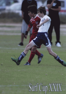 Alex is also showing fine form here, at full stretch and just ahead of the boy on the other team pursuing a ball which is a whisker out of the frame.