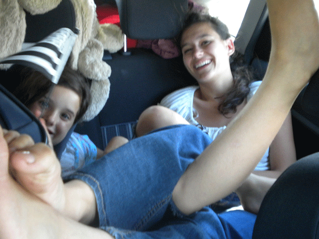 Lou with her sister Daphné in the back of the car, on the way to or from Provence. 