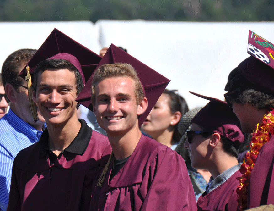 James and Charlie approaching the stage to receive their diplomas at their High School graduation. Alec and Noah are behind them looking the other way. The ceremony was held on the field which was the site of most of thier home soccer games, and the boys talked about their memories of those games as they waited in line. 